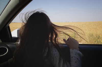 Portrait of woman against sky