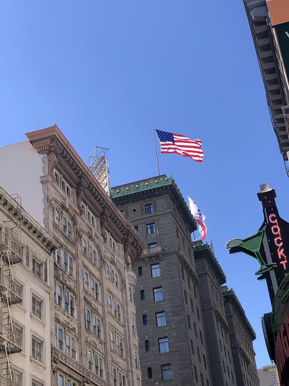 LOW ANGLE VIEW OF BUILDINGS AGAINST CLEAR SKY