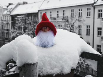 Close-up of snow on built structure in winter