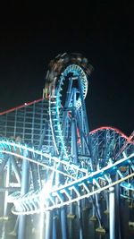 Low angle view of illuminated ferris wheel