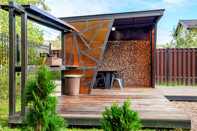 Picnic area with barbecue grill and table and chairs.