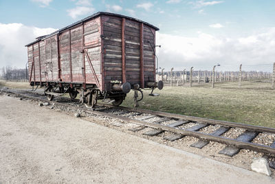 Train on railroad track against sky