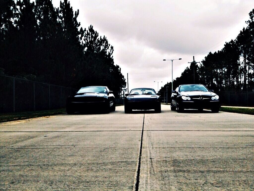 transportation, car, mode of transport, land vehicle, sky, road, tree, cloud - sky, street, cloud, the way forward, cloudy, on the move, travel, stationary, outdoors, parking, day, sunlight, no people