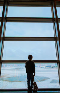 Low angle view of man standing in city