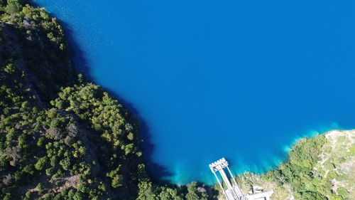 High angle view of trees against blue sky