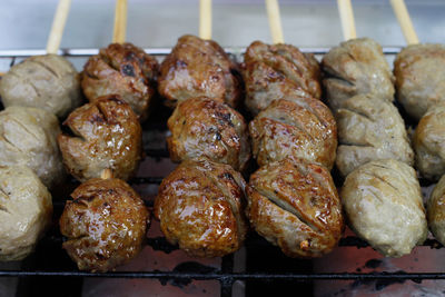 High angle view of meat on barbecue grill