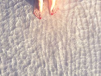 Low section of woman in water