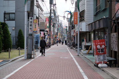 Man walking on street in city