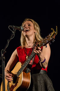 Young woman holding guitar