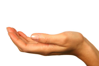 Close-up of person hand against white background