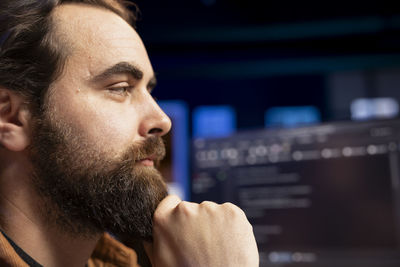 Side view of young man looking away