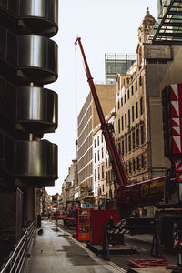 City street amidst buildings against sky