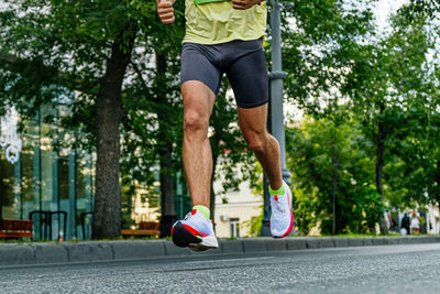 Full length of man exercising on road