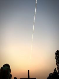 Low angle view of vapor trails in sky