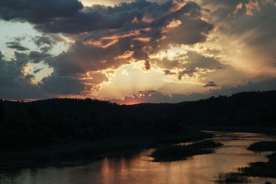 Scenic view of lake against sky during sunset