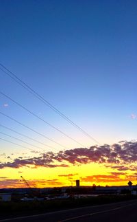 Scenic view of landscape against sky at sunset