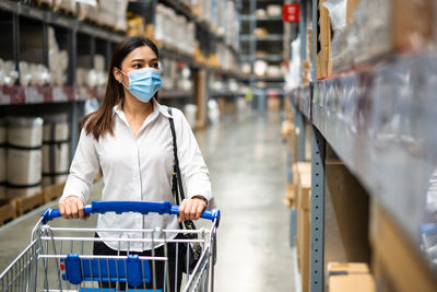 Full length of woman looking at store