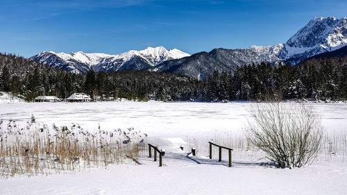 Bridge on a frozen lake, wintertime at mittenwald, lautersee, bavaria