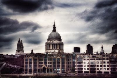 Low angle view of building against cloudy sky