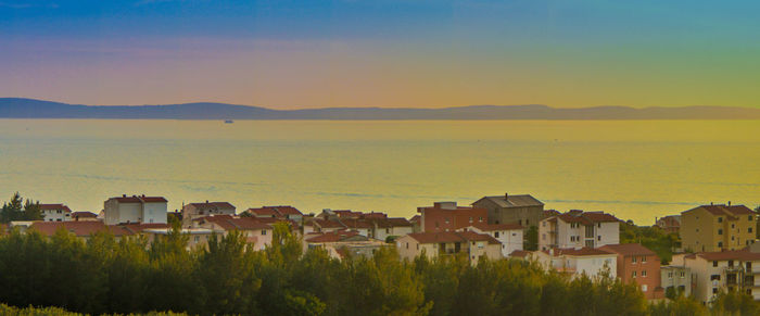 Houses in town at sunset