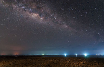 Scenic view of field against sky at night