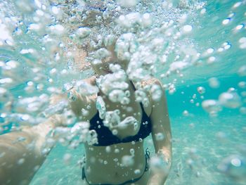 Close-up of woman swimming in pool