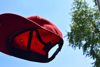 Low angle view of baseball cap against the sky