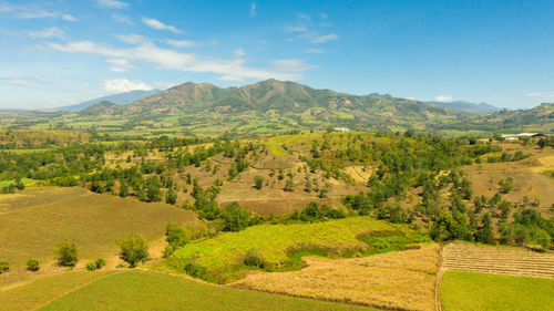 Agricultural landscape with farmland. mountain landscape with green hills and farmland. 