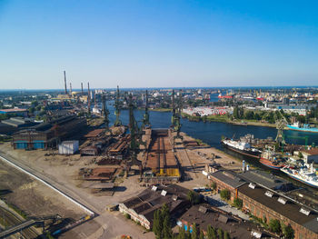 High angle view of buildings against clear blue sky
