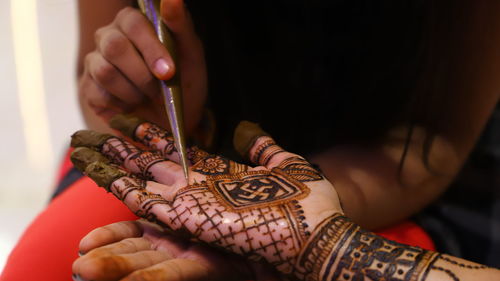 Close-up of woman holding hands