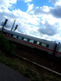 Train on railroad track against sky