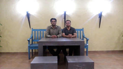 Young couple sitting in corridor