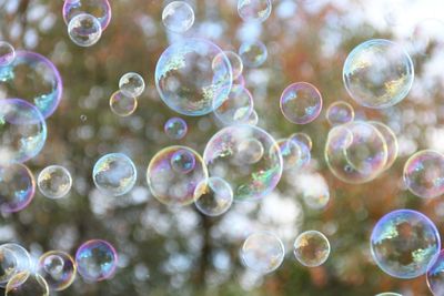 Close-up of bubbles blowing in mid-air