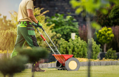 Low section of man working on field