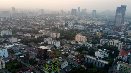 High angle view of buildings in city against sky