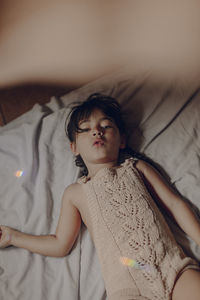 Girl lying on bed at home