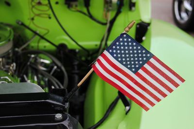 Close-up of american flag on car engine