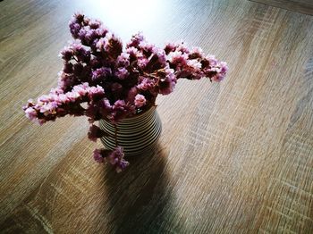 High angle view of pink flower vase on table