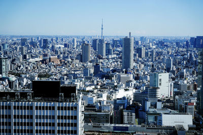Modern buildings in city against clear sky