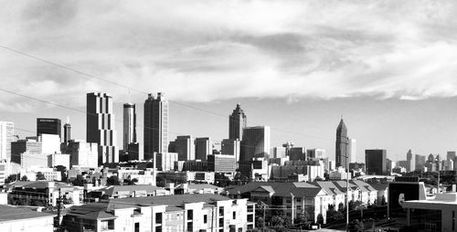 Modern buildings in city against sky