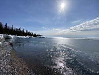 Scenic view of sea against sky during winter