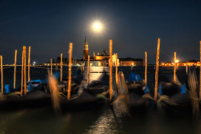 Church of san giorgio maggiore viewed against the gondolas resting on the lagoon. venice, italy