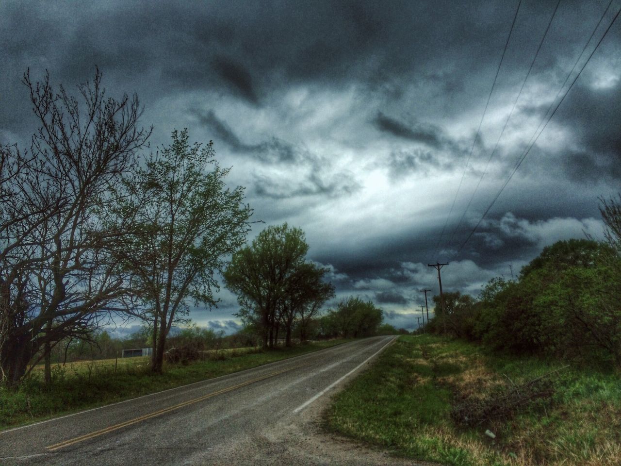 transportation, the way forward, sky, cloud - sky, cloudy, diminishing perspective, tree, railroad track, road, vanishing point, rail transportation, electricity pylon, nature, power line, weather, landscape, cloud, overcast, country road, no people