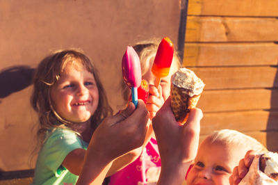 Close-up of smiling girl with chocolate