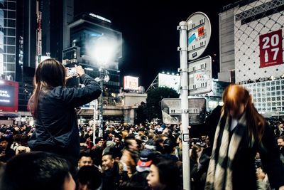 People in city at night