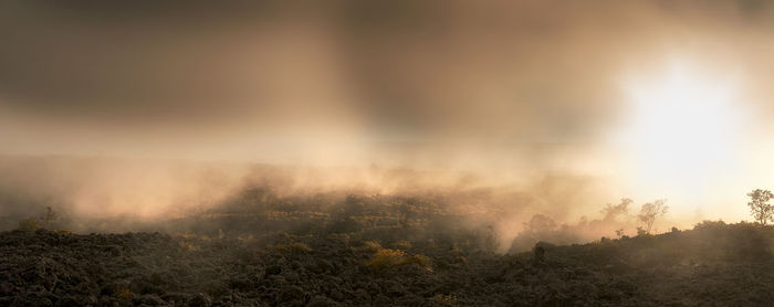 Scenic view of landscape against sky during sunset