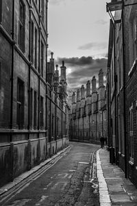 Street amidst buildings in city against sky