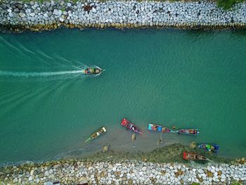 High angle view of people swimming in sea