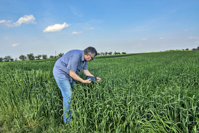 Full length of man standing on field