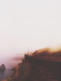 View of suspension bridge over sea